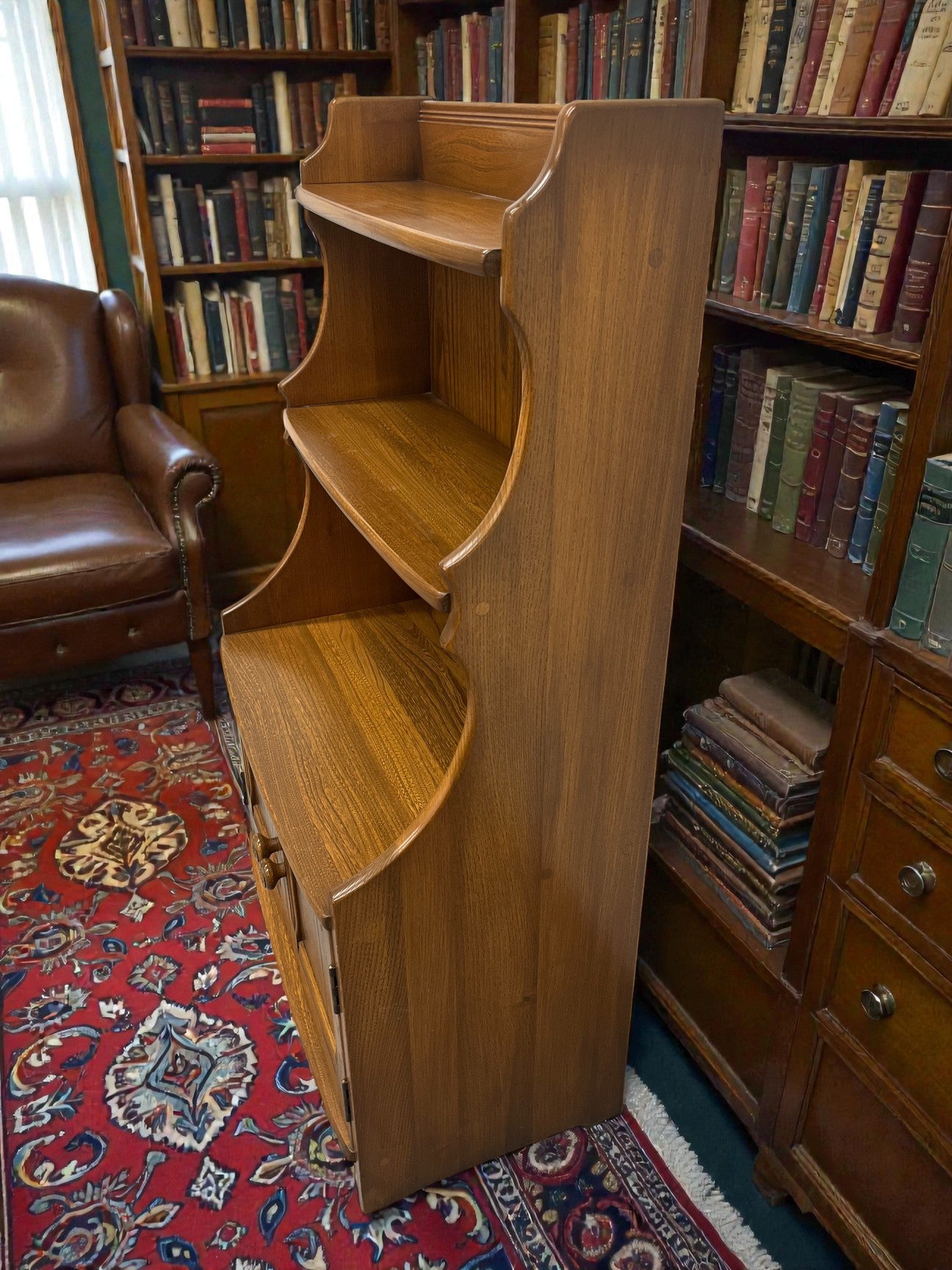 Ercol Golden Dawn Waterfall Bookcase with Cupboard | Mid-Century Elm